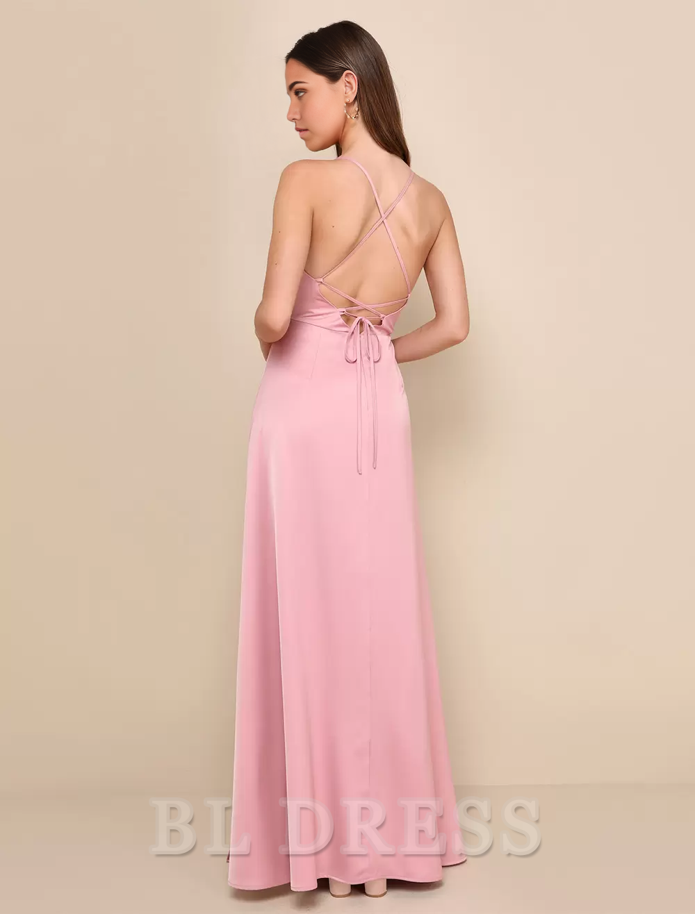 Back view of the A-Line formal dress, showing open back design and spaghetti straps.