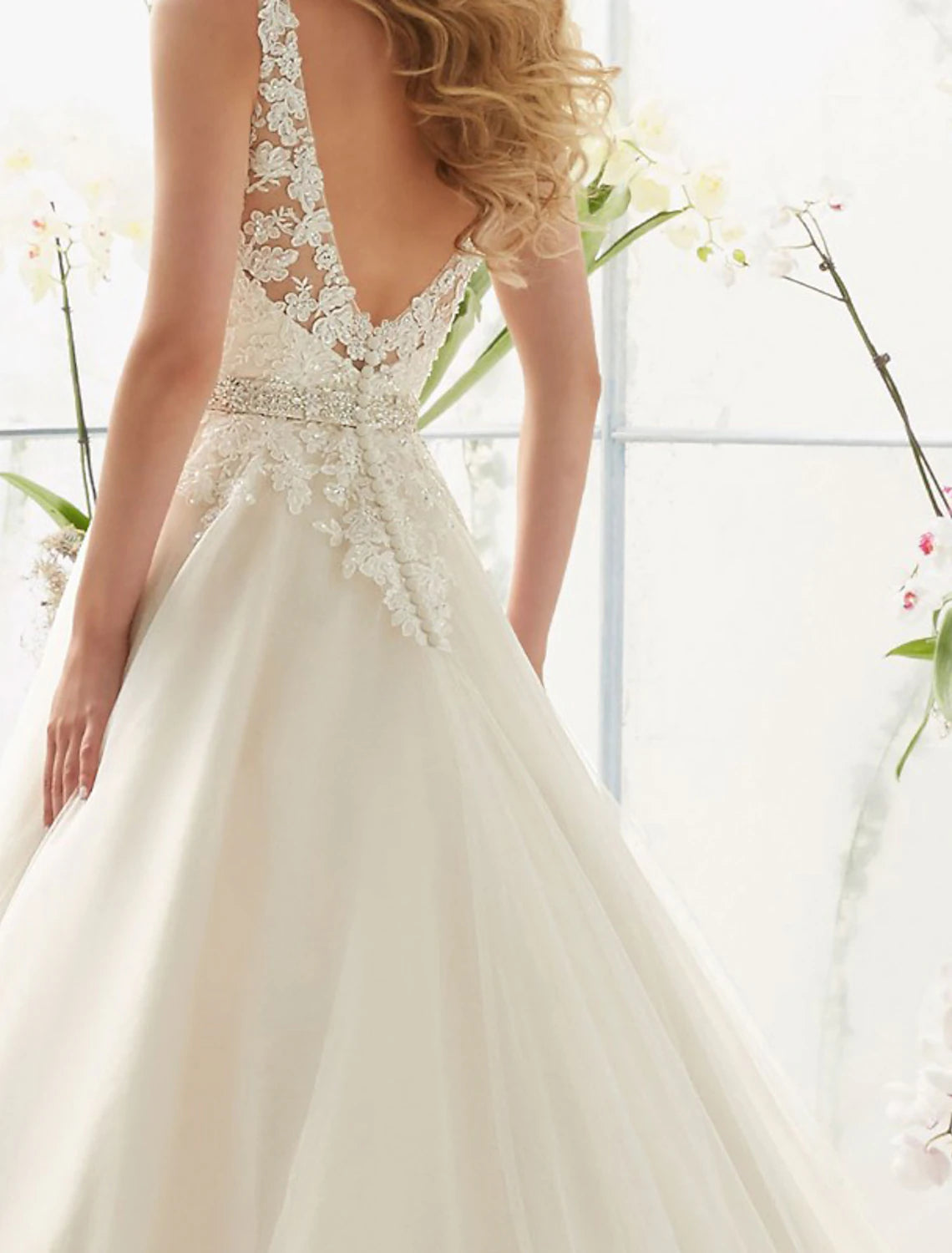 Back view of the A-Line lace wedding dress showing open back detail.