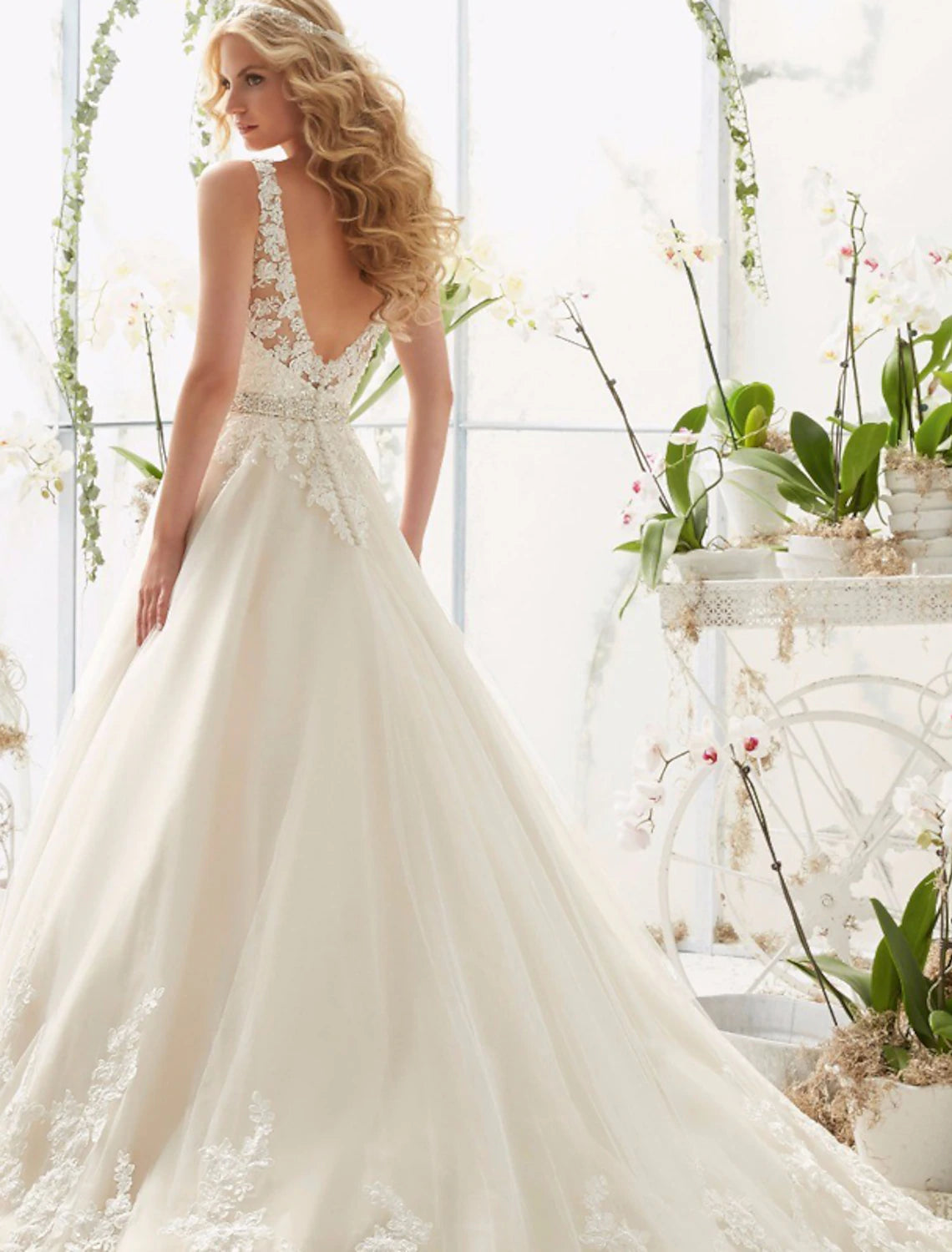 Front view of the elegant A-Line wedding dress with V-neckline.