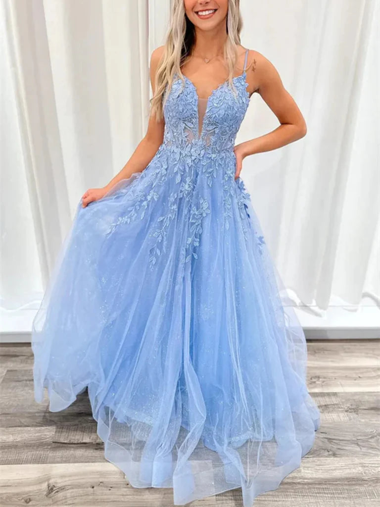 Woman wearing an elegant A-line V-neck lace long prom dress with an open back.