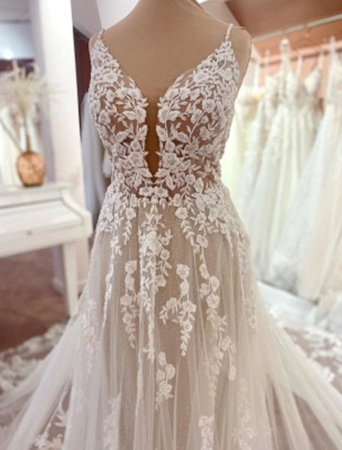Close-up of intricate lace appliques on the formal wedding dress.