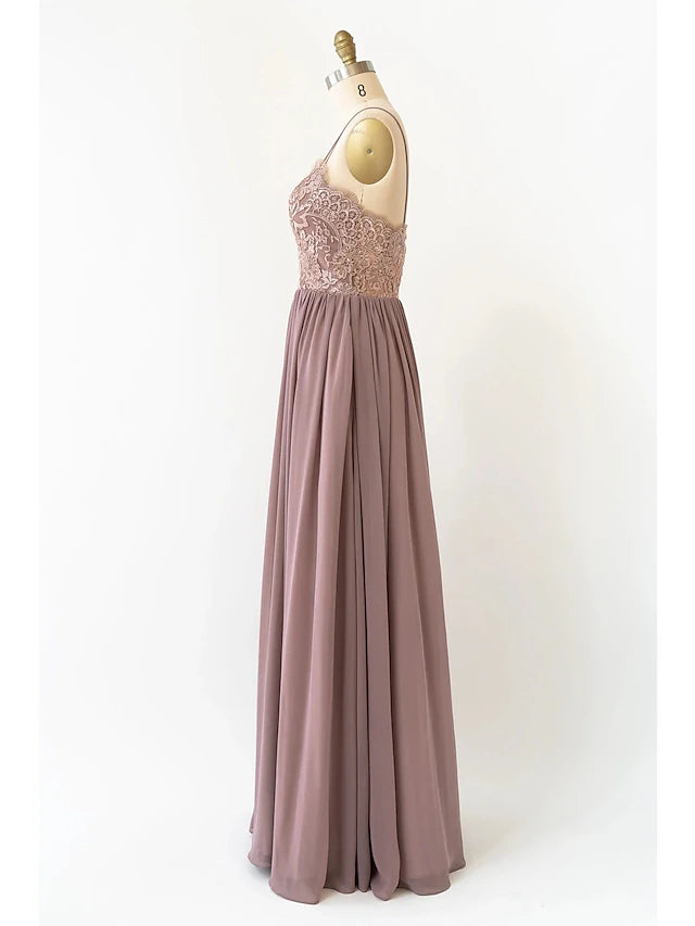 Close-up of the V-neckline and pleated bodice on a chiffon dress.