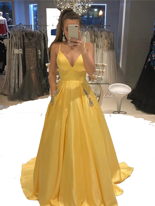 Elegant A-Line V-neck satin evening gown with open back and crystal beading.