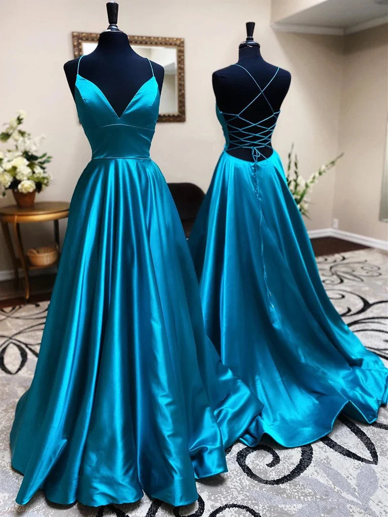 Woman wearing an elegant A-line V-neck open back satin long dress.