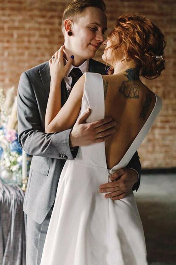 Long satin bridal gown with elegant V-neckline.