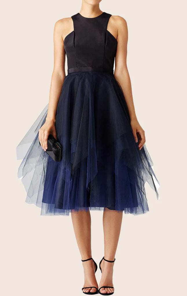 Woman wearing an elegant tulle satin formal gown.