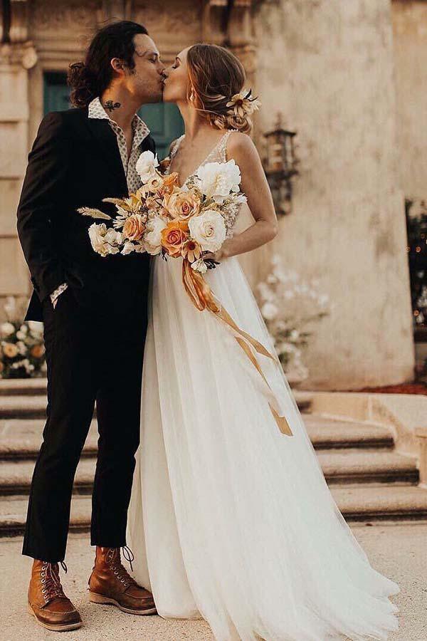 Back view of the ivory pearl beaded see-through wedding dress.