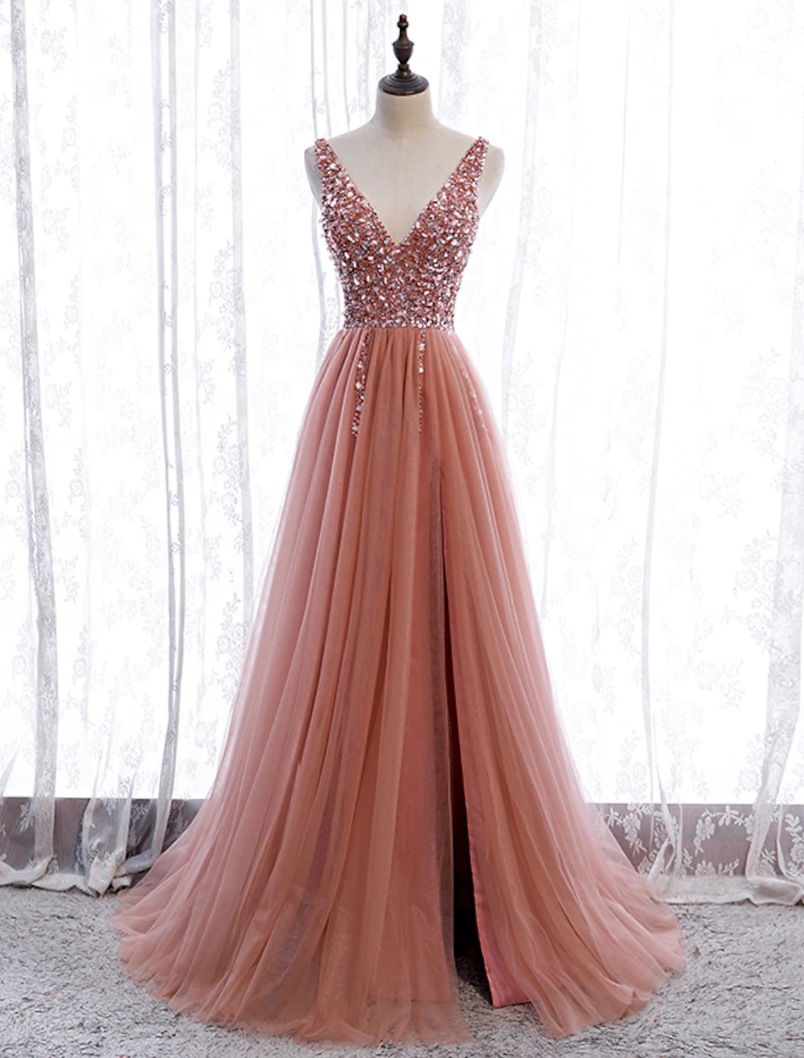 Elegant A-line V-neck prom dress with pearl embroidery and court train.