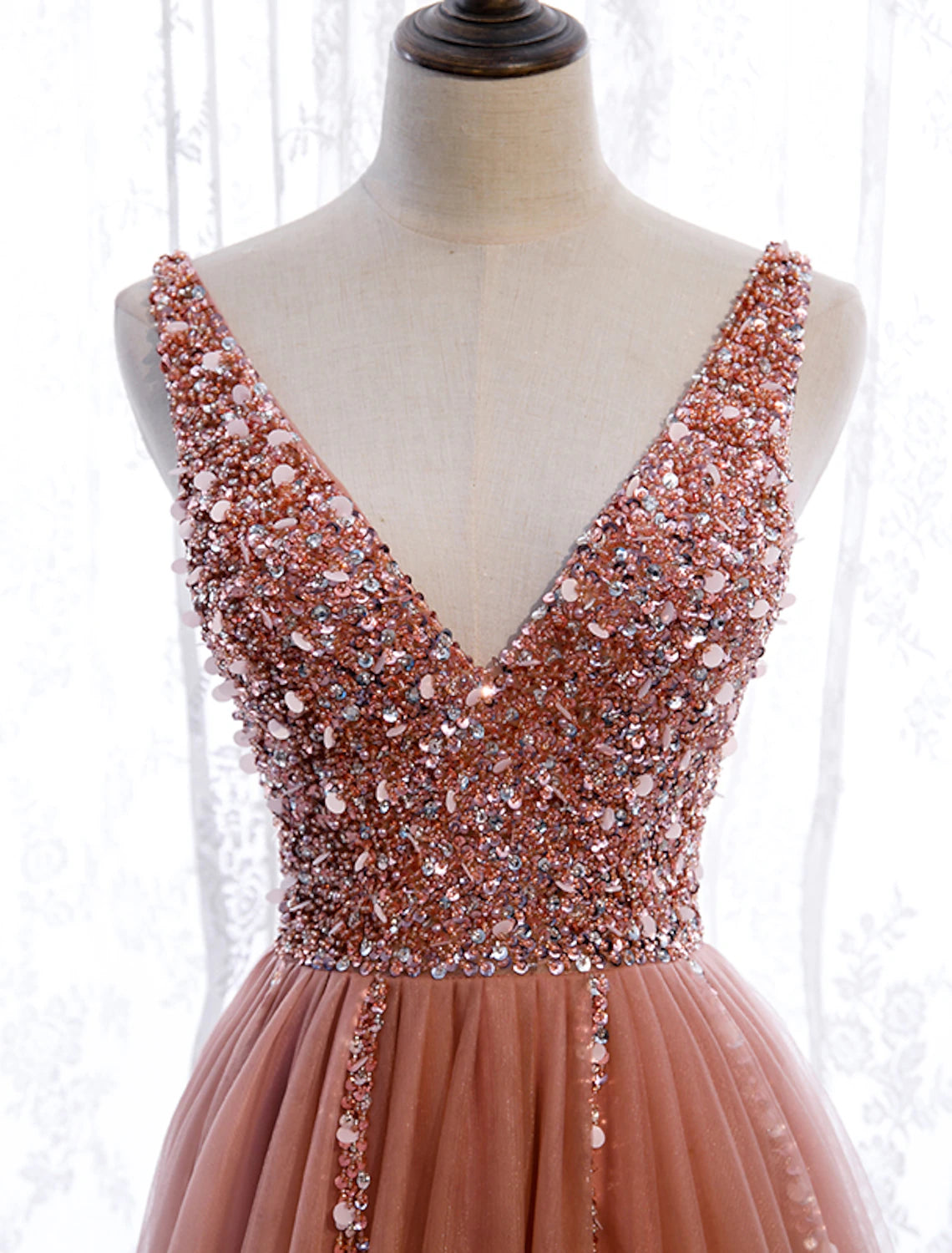 Close-up of pearl embroidery on the V-neck prom dress.