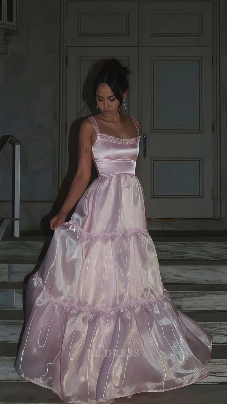 Elegant A-line pink organza formal gown with V-neckline.