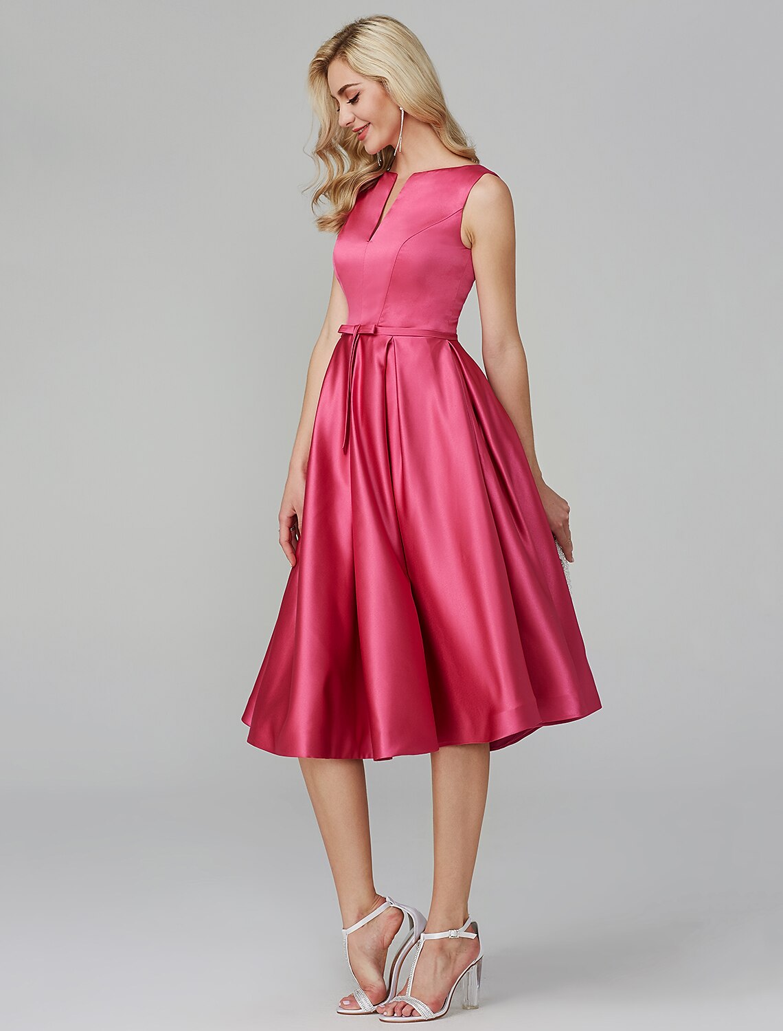 Side view of pink satin A-line dress, knee length.