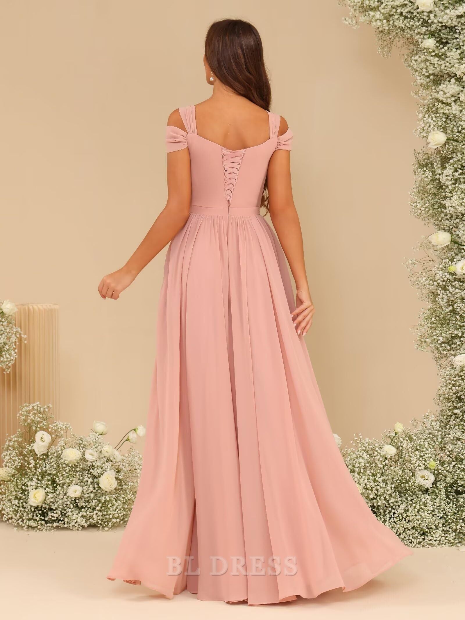 Model showcasing the elegant black A-line V-neck dress with pleated details.