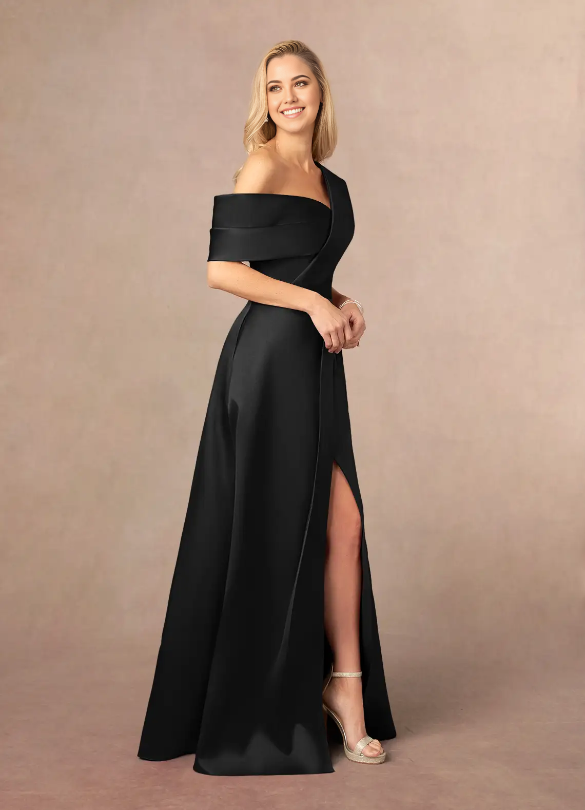 Woman wearing an elegant black A-line V-neck pleated formal dress, back view.