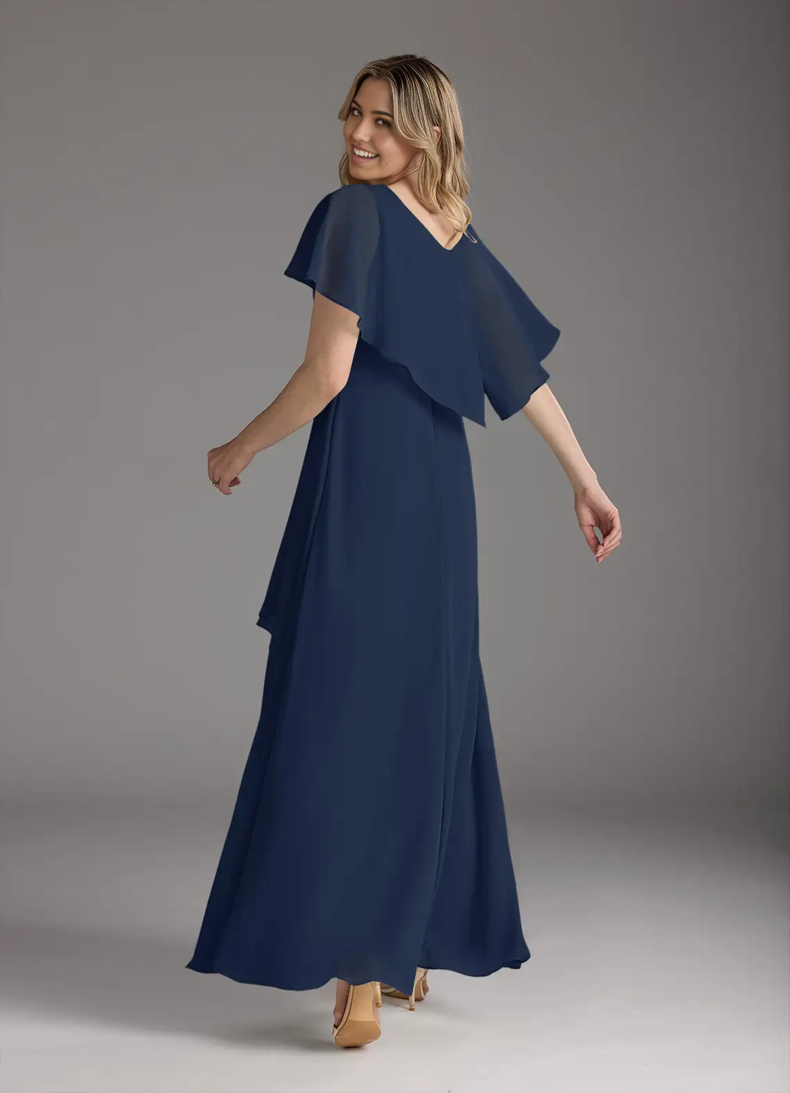 Elegant dark navy Mother of the Bride gown with pleated details.