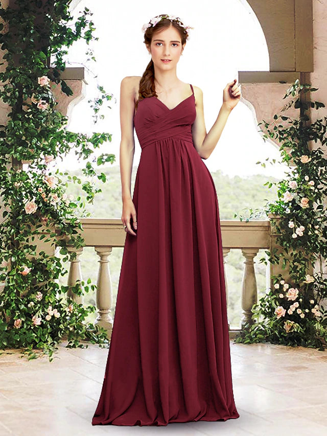Elegant A-line chiffon bridesmaid dress with V-neck and spaghetti straps, flowing to floor length.