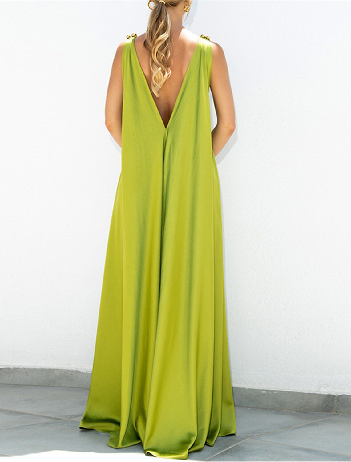 Side profile of the pleated A-Line chiffon dress, ideal for formal events.