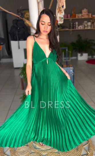 Elegant A-line V-neck green formal dress with spaghetti straps and pleated skirt.