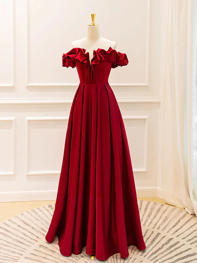 Full view of the elegant A-line V-neck prom gown with pleats and strappy details.