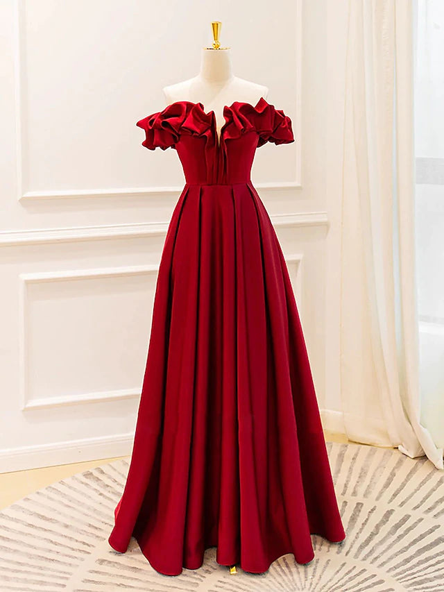 Close-up of the V-neckline and delicate strappy bodice of the formal dress.