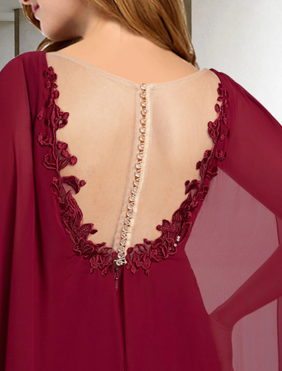 Back view of the A-line V-neck Mother of the Bride dress, showcasing the sweep train.