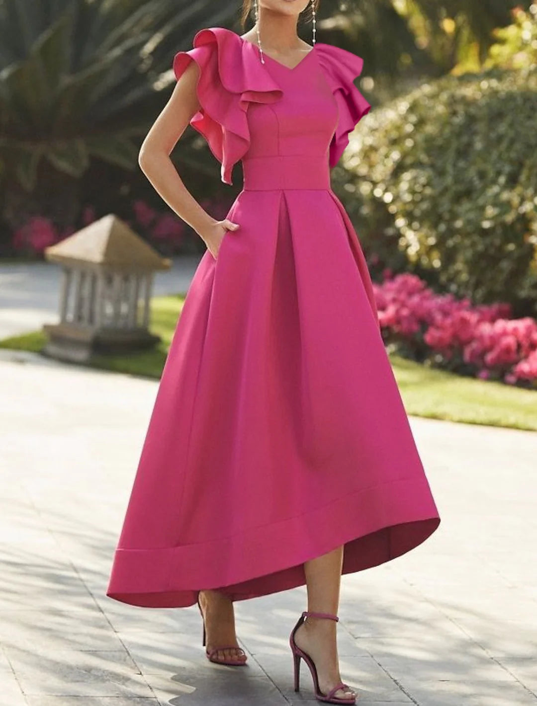 Woman wearing an elegant A-line V-neck prom dress.