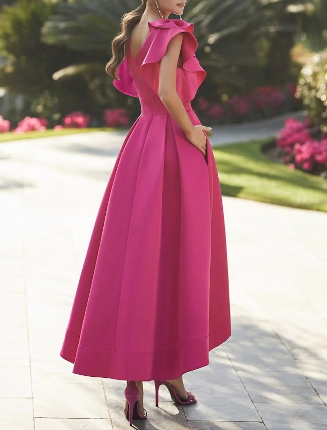 Close-up of the V-neckline and bodice of the A-line formal dress.