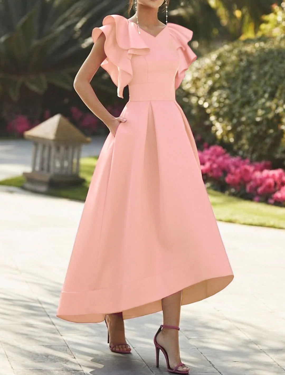 Full view of the flowing A-line skirt and ankle-length design of the prom gown.