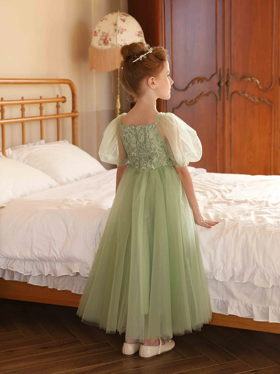 Side view of the A-line tulle flower girl dress, highlighting the puff sleeves.