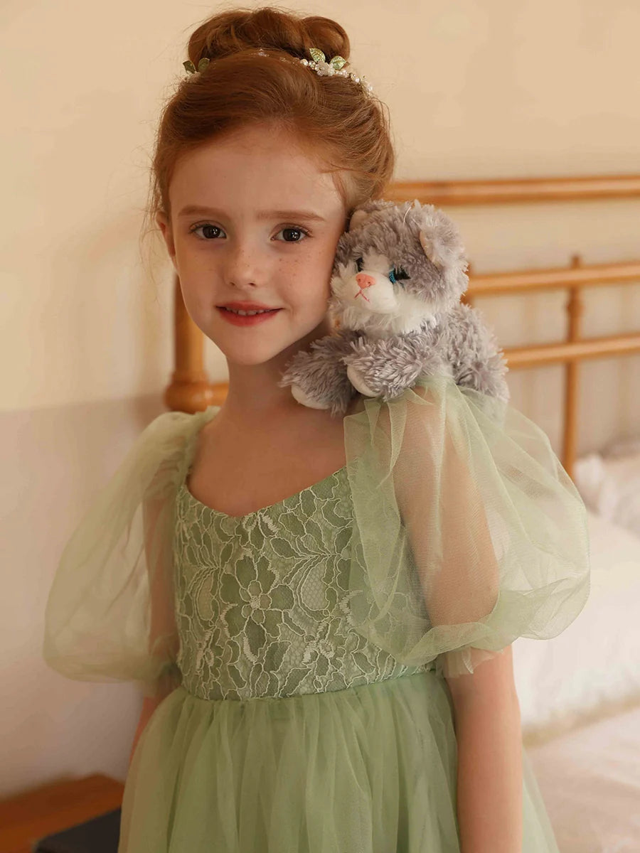 Flower girl dress in motion, emphasizing the beautiful A-line tulle skirt.