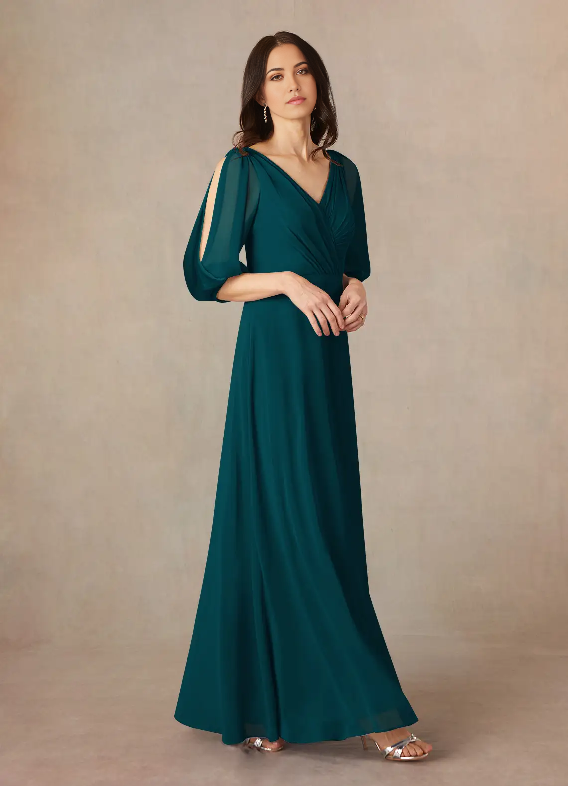 Side view of a flowing chiffon Mother of the Bride dress.