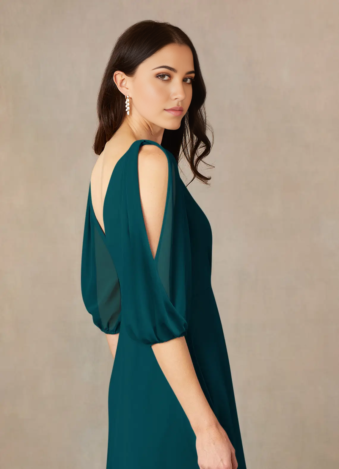Close-up of ruched detail on a V-neck formal dress.