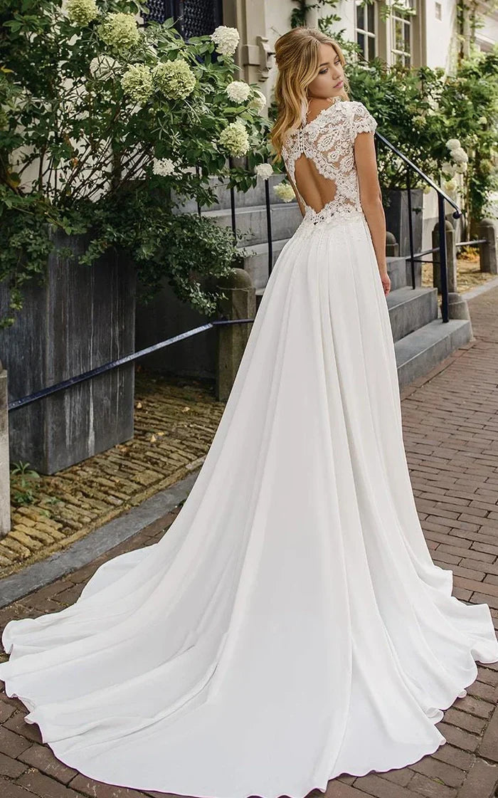 Close-up of V-Neck bodice with lace details and ruching on a wedding dress.