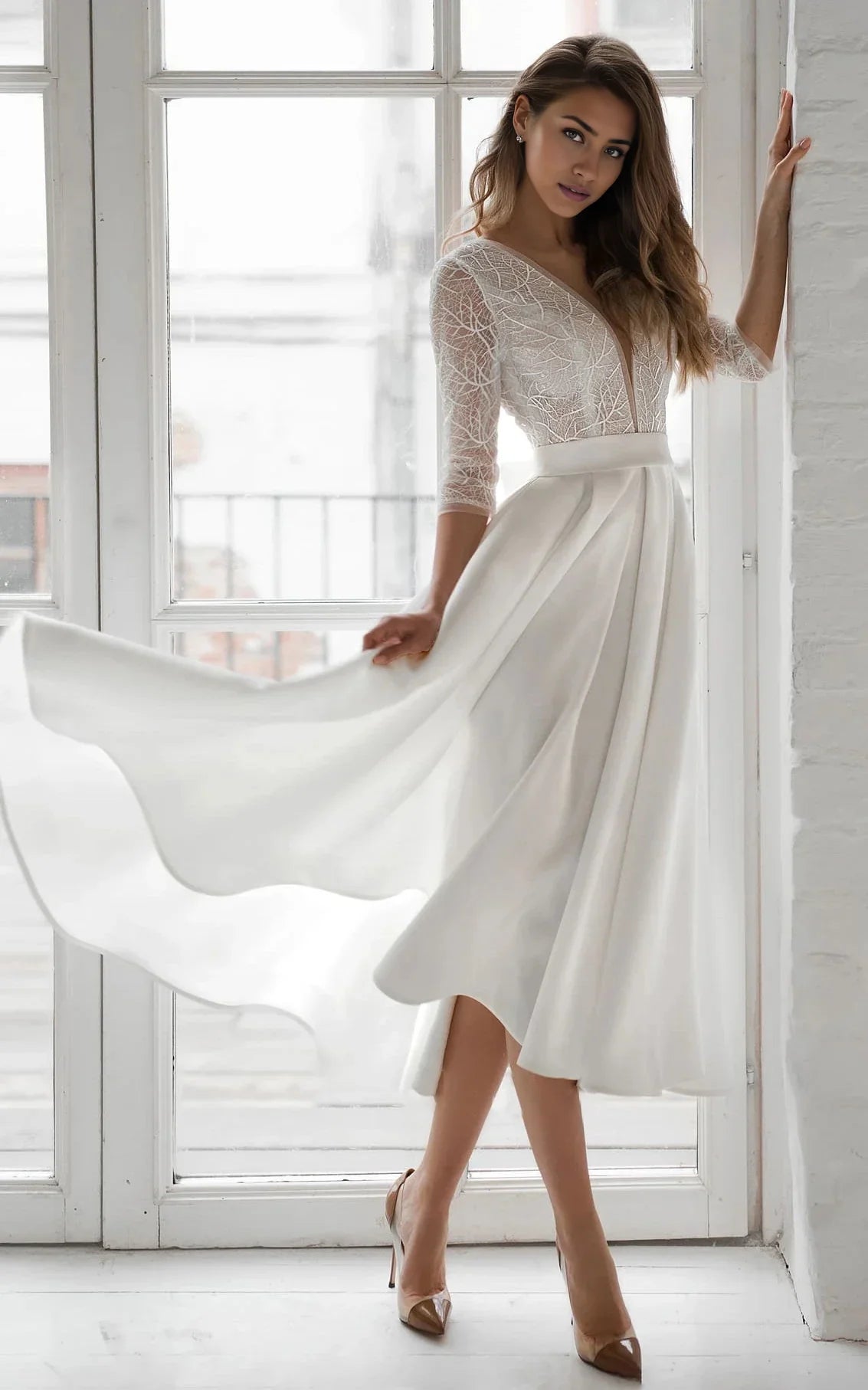 Elegant A-Line V-neck satin tea-length wedding dress.