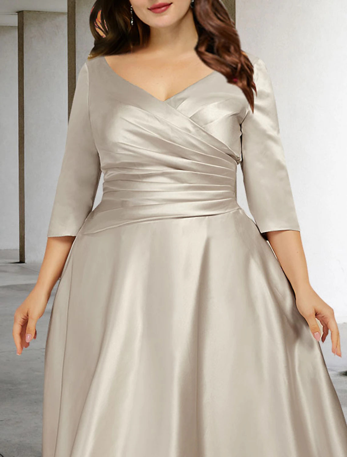 Elegant tea-length satin dress for Mother of the Bride, featuring an A-line silhouette.