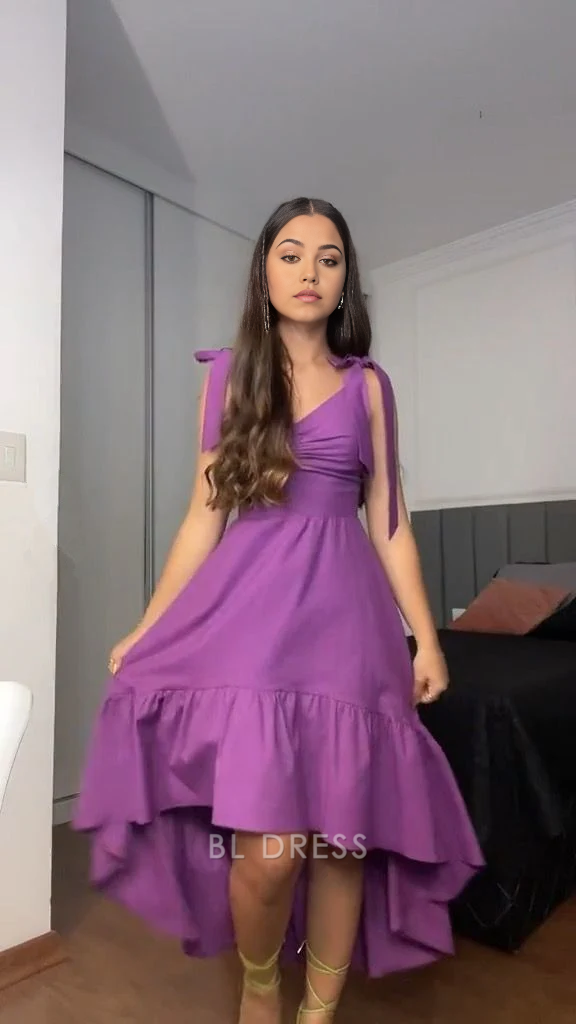 Purple A-line formal dress with V-neck and ruffle details.