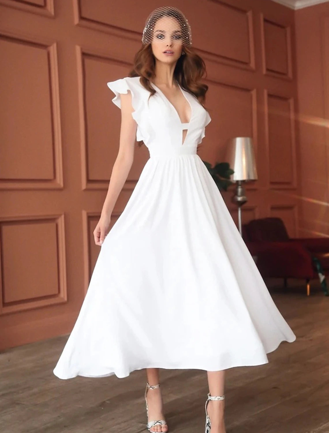 Elegant A-Line V-neck tea length dress.