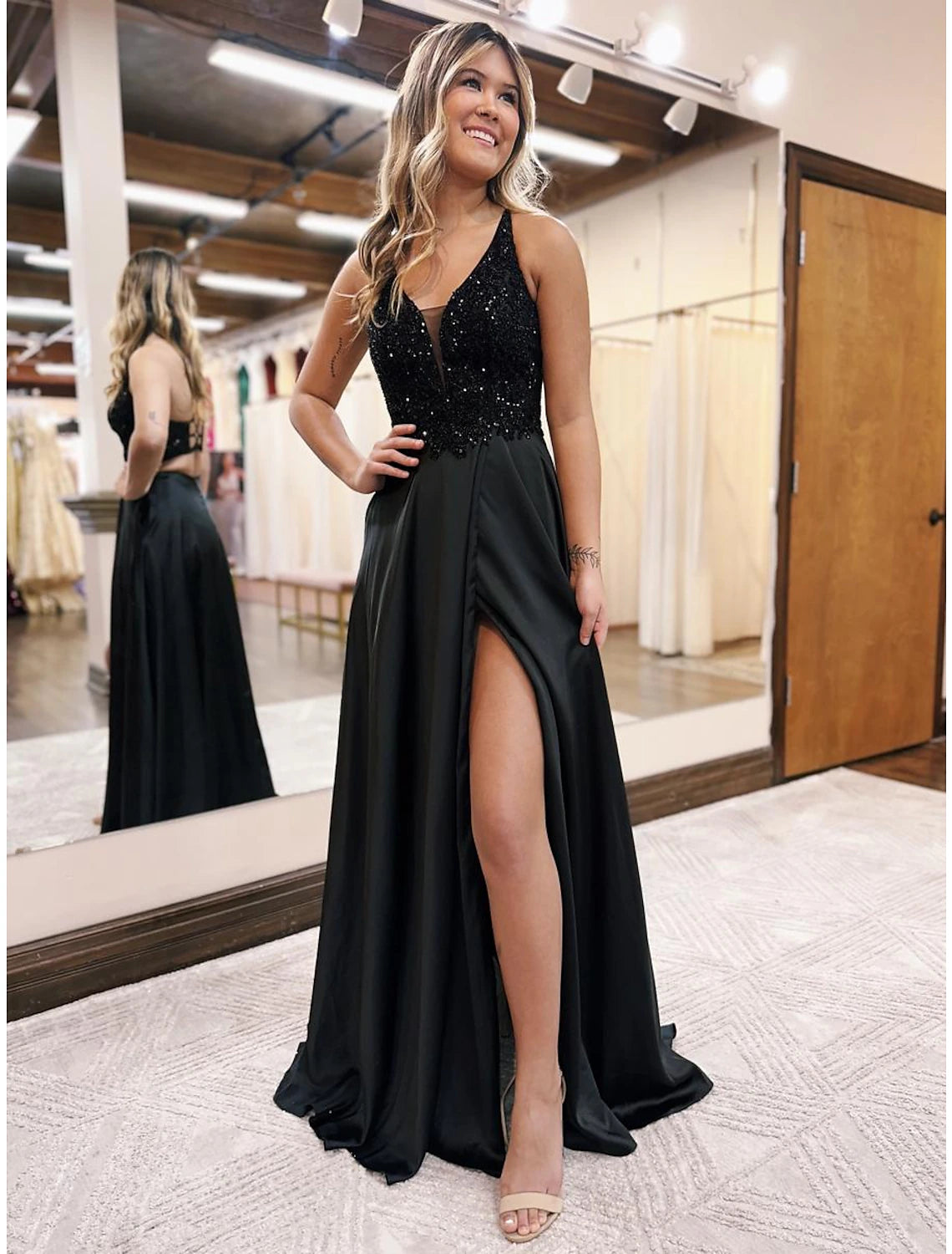 Elegant A-line V-neck satin evening gown with beading appliques and pockets.