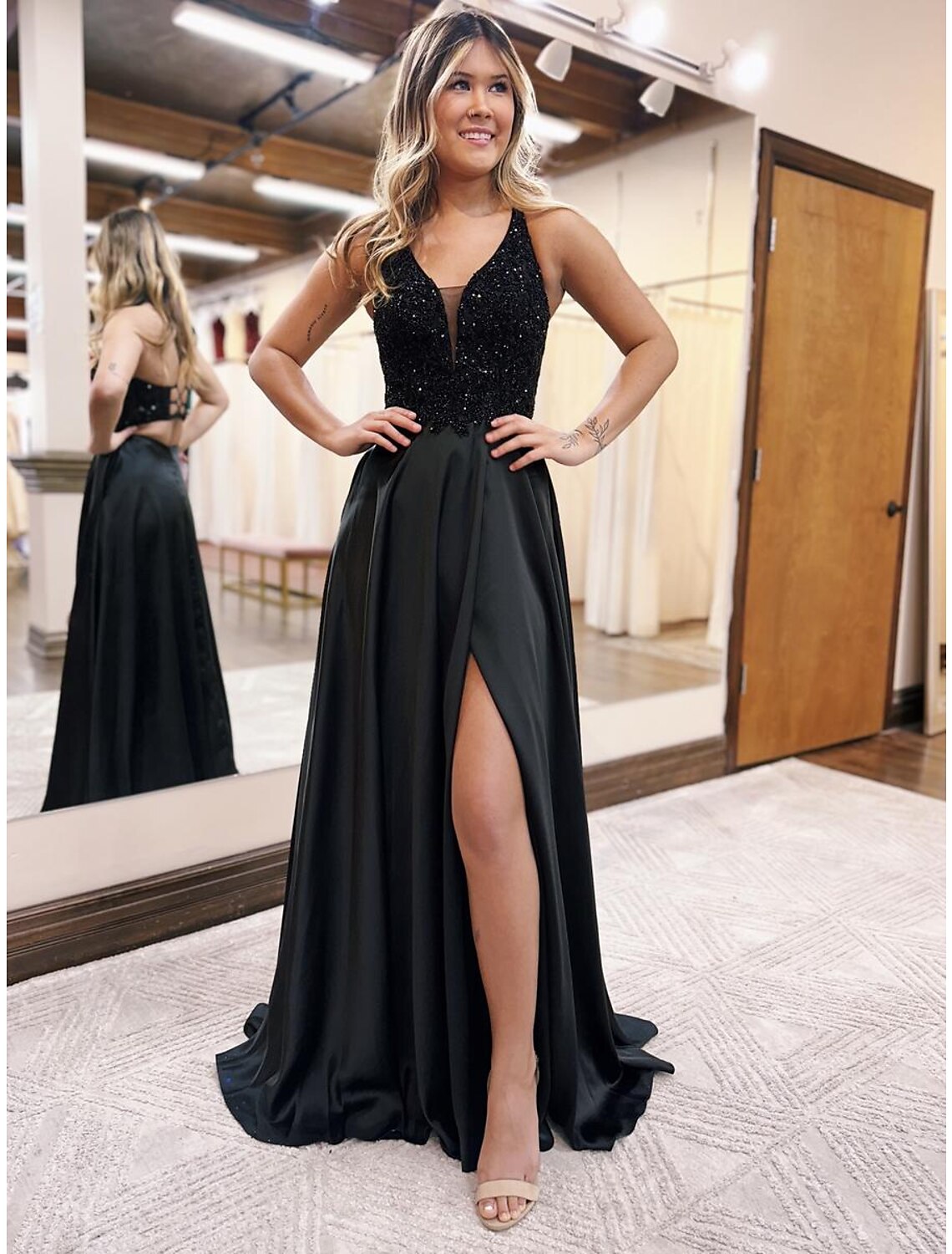 Side view of A-line V-neck satin evening gown with flowing skirt.