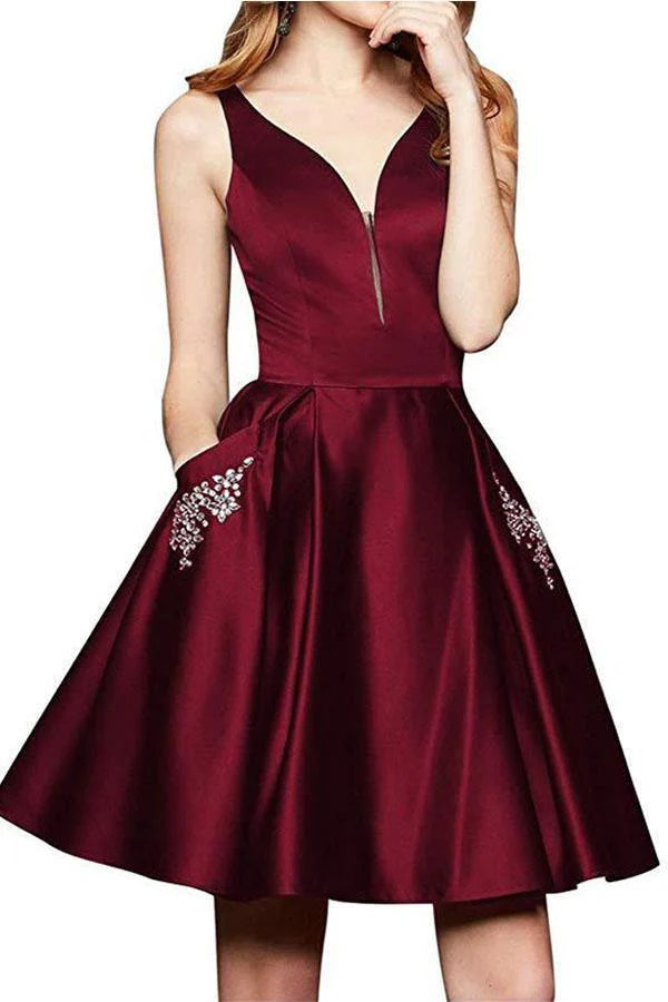Full view of an A-line V-neck satin beaded homecoming dress with pockets.