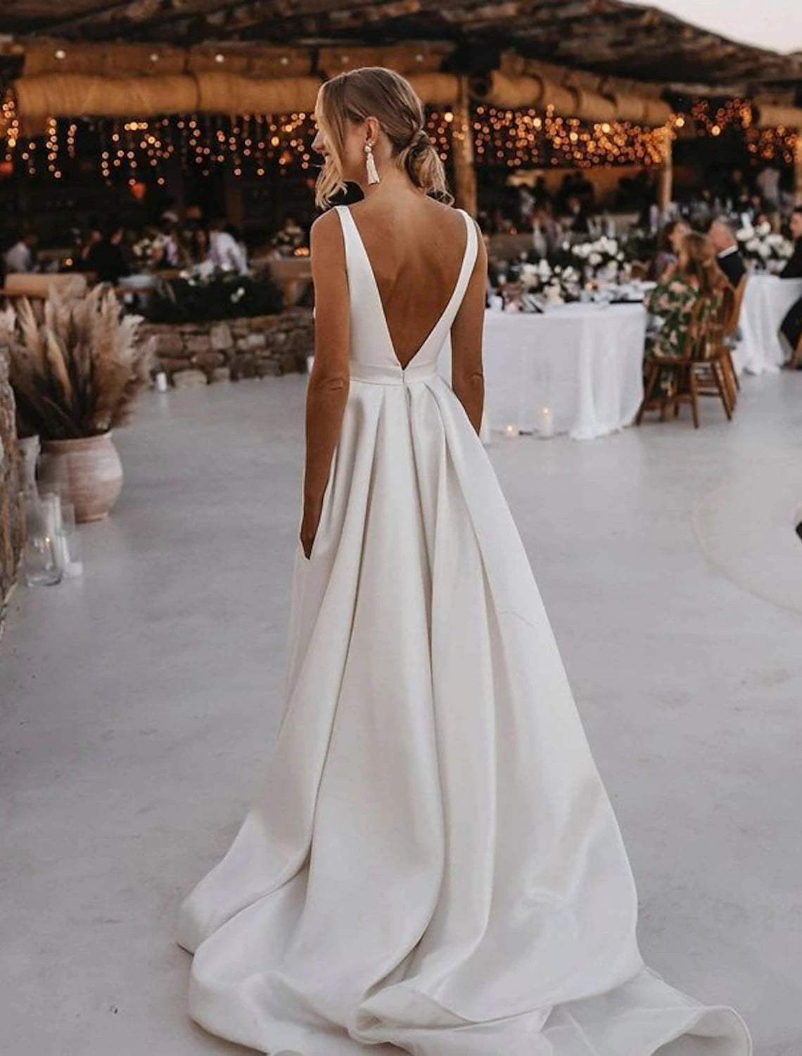 Back view of the A-line V-neck satin bridal gown, showing the court train.