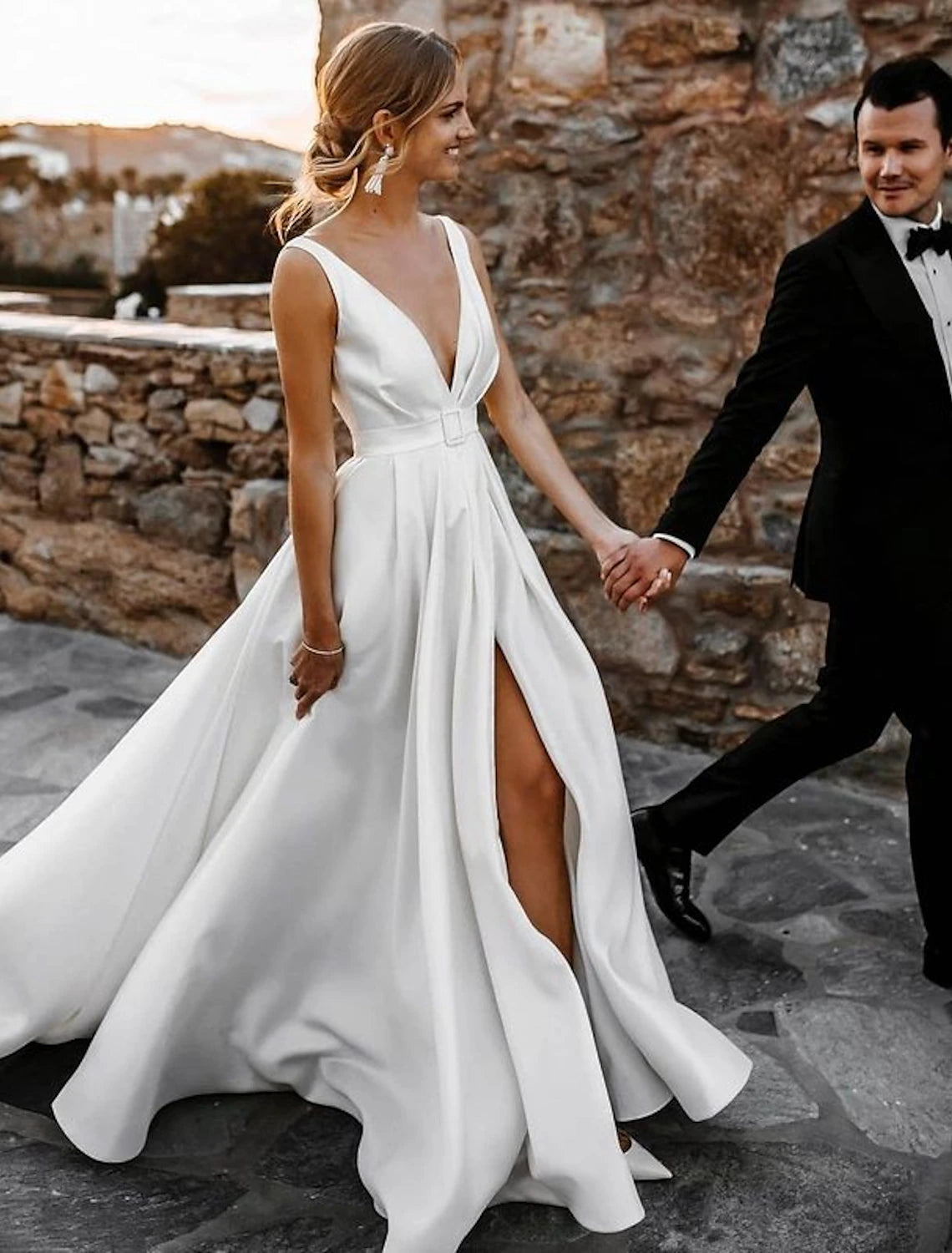 Full length view of the elegant A-line wedding dress, suitable for a beach ceremony.