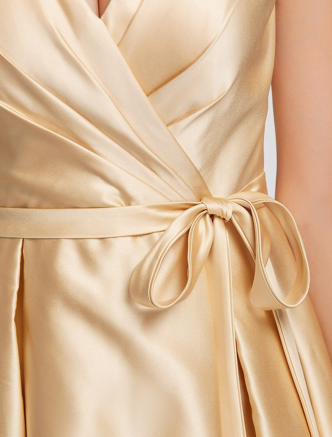 Back view of an A-line V-neck satin bridesmaid dress with a sash.