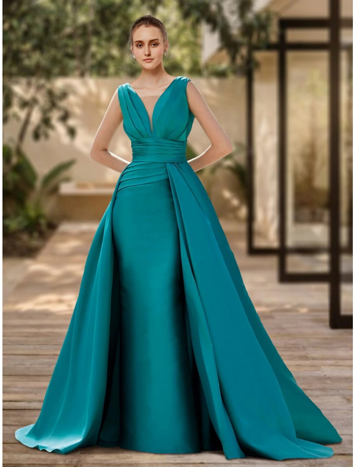 Model wearing a red A-line V-neck satin evening gown with pleats and a sweep train.