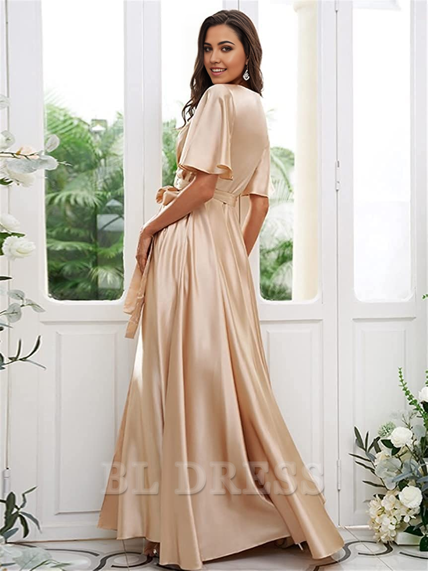 Back view of a woman in a flowing A-line satin formal dress.