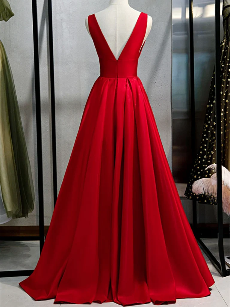 Full length view of a navy blue satin formal evening dress.