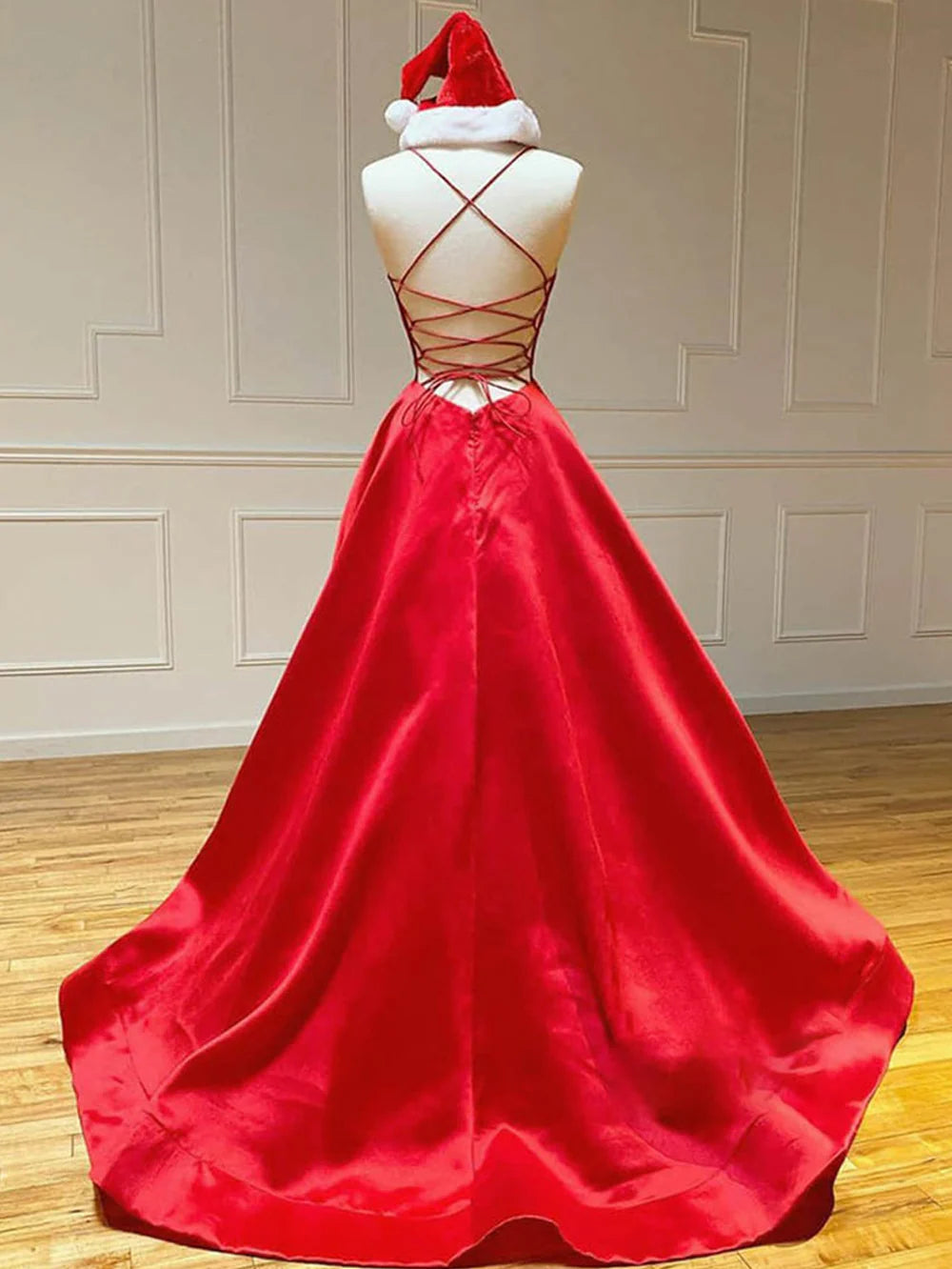 Side view of a woman in an A-line V-neck satin long prom dress.