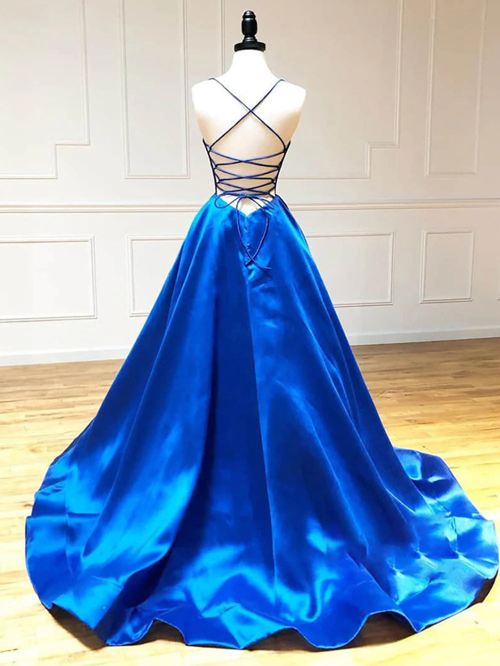 Close-up of the V-neckline and smooth satin fabric of the formal dress.