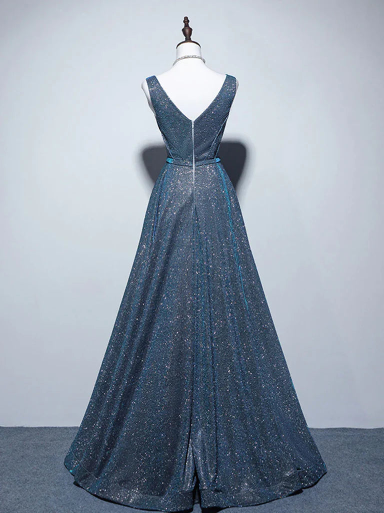 Woman posing in a flowing A-line V-neck satin formal gown.