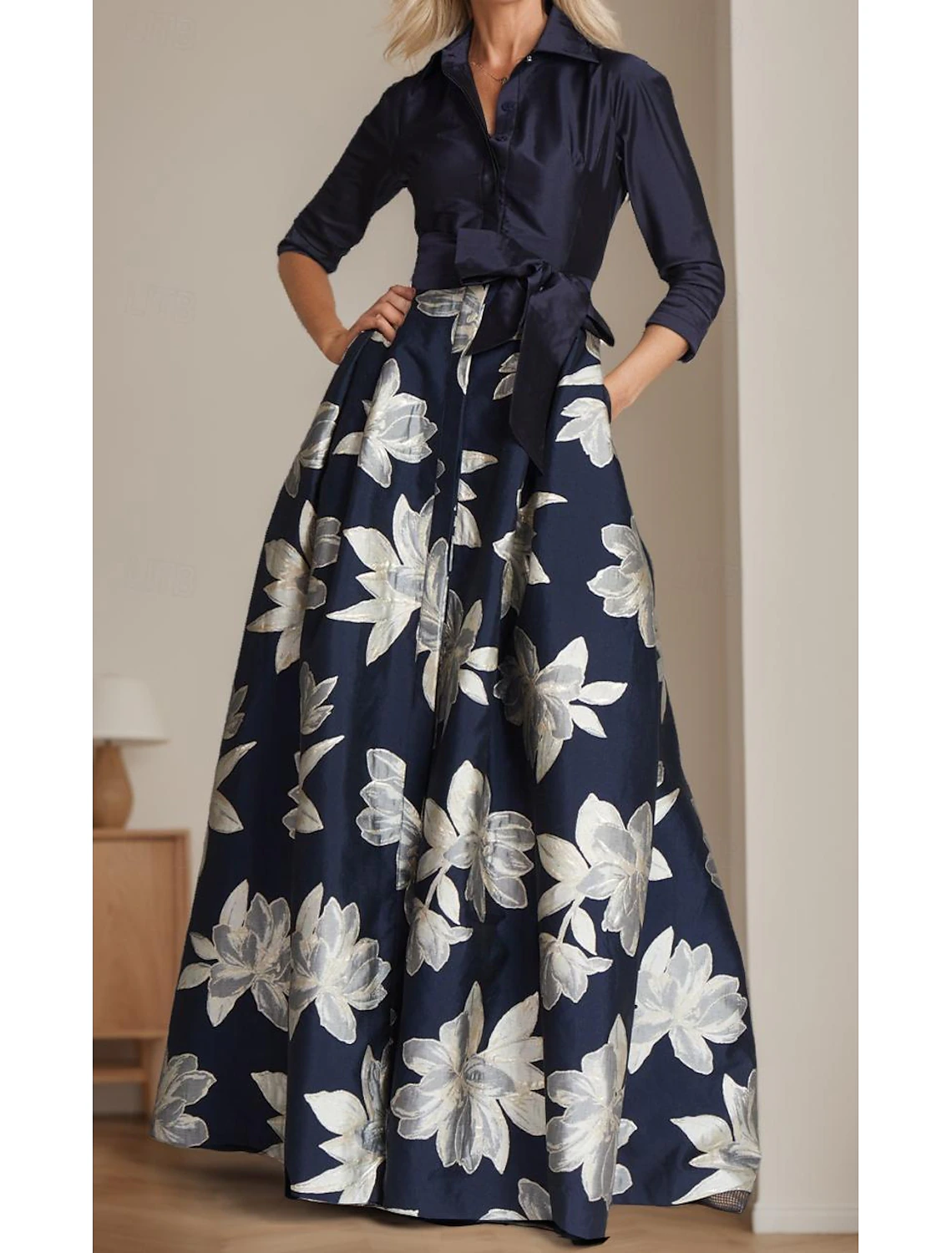 Sophisticated satin Mother of the Bride dress, showcasing its elegant drape.