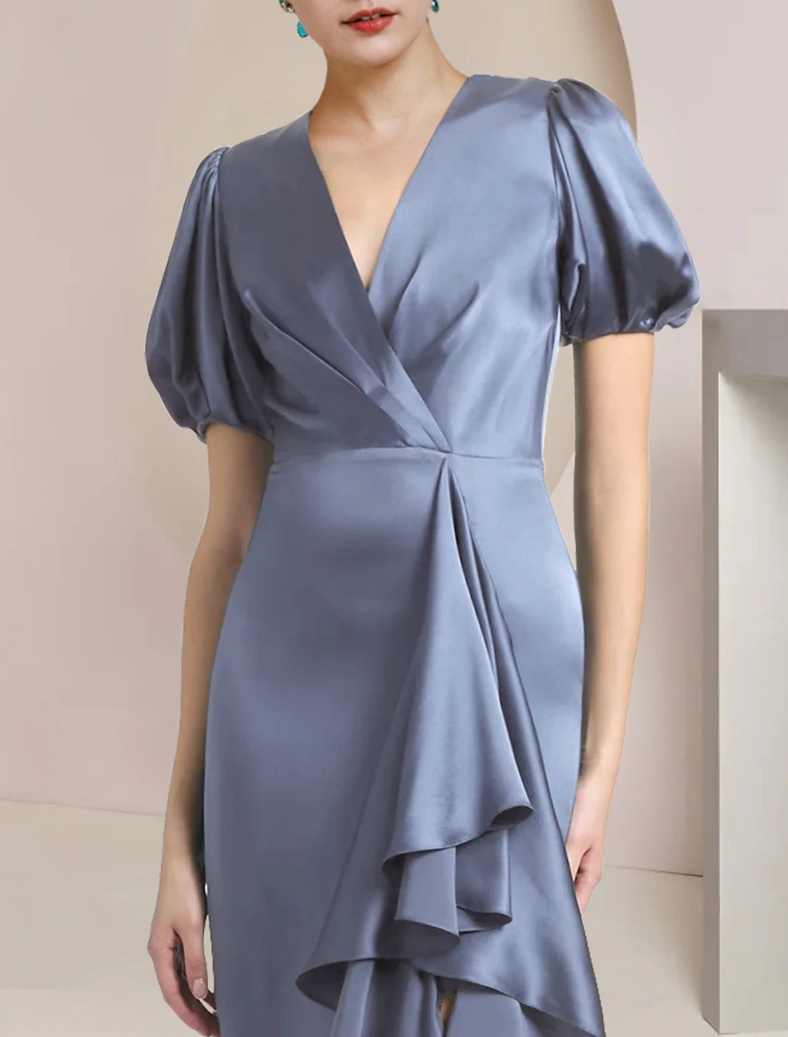 Side profile of the V-neck satin gown, highlighting the A-line silhouette and short sleeves.